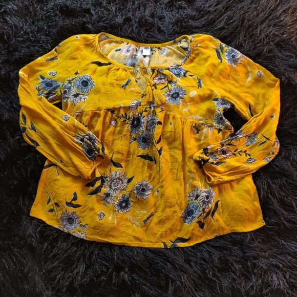 Long sleeved yellow floral flowy rayon blouse.